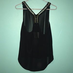 Dressy racer back black top with gold accents